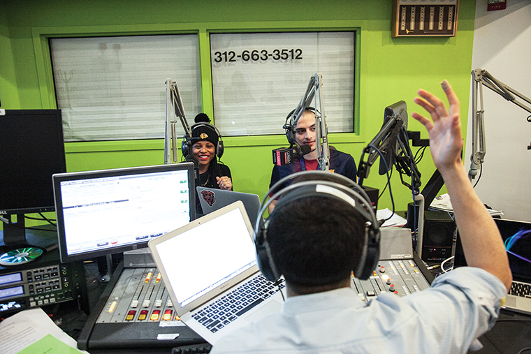 West Side rapper Bella Bahhs (left) sits in on the “The Benchwarmers,” hosted by Chronicle Media Relations Editor Nader Ihmoud (front) and Eduardo Saldana (rear). The Monday night radio show is broadcast on Columbia’s WCRX 88.1. Host Ihmoud praised Bahh’s song “Good Loud” and pleaded with her to release a clean version that he could play on air. 