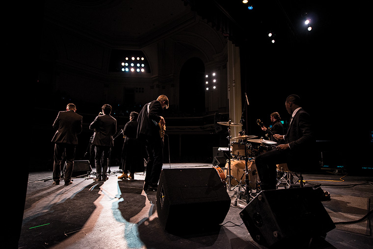 The ensemble performs in front of six judges, who gave the group elite scores in every category.
