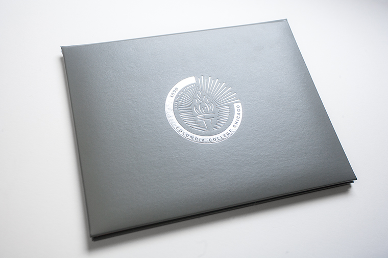 The colleges new diploma, designed by Hannah Rebernick, a Columbia graphic design alumna, incorporates the colleges new seal.