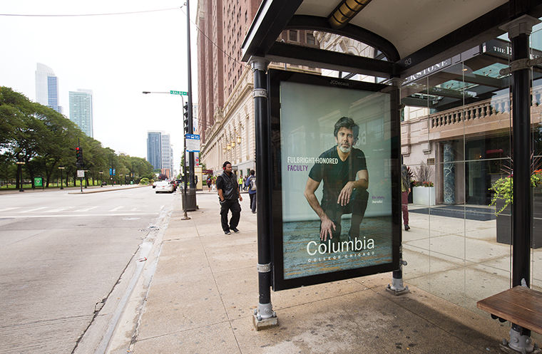 Elio Leturia, an associate professor in the Journalism Department, is featured on an advertisement at a bus stop at Balbo and Michigan Avenues in a city-wide advertising campaign the college launched in August.