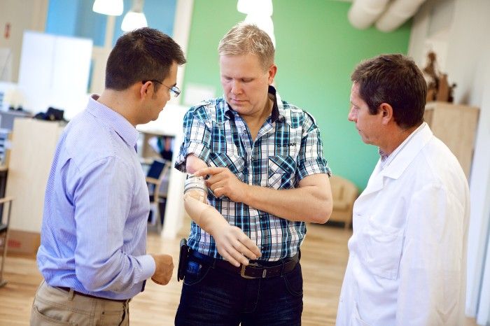 Max Ortiz Catalán, a research scientist at Chalmers, works with a mind-controlled prosthetic arm.