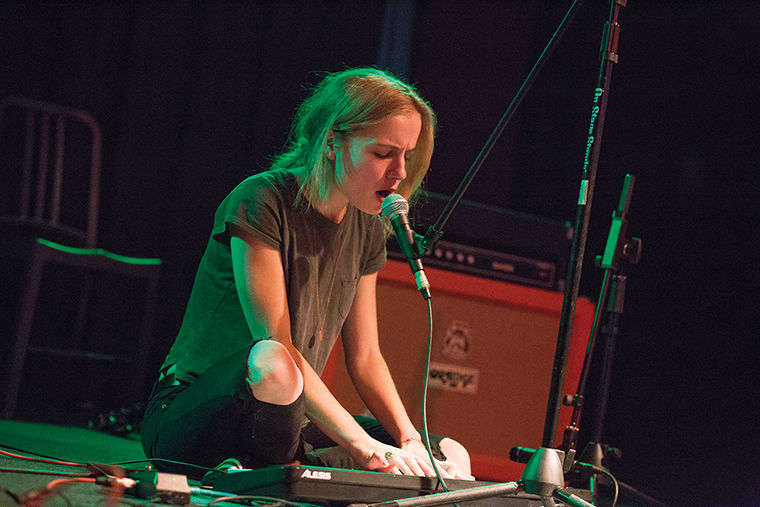 Maire Hahn sings for an audience and plays the keyboard during AEMMP Records release party.