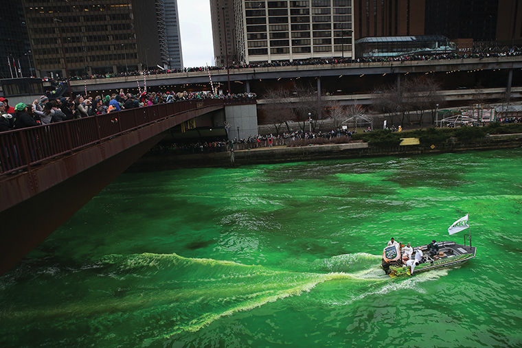 Workers dye the Chicago River green to kick off the citys St. Patricks day celebration on March 16, 2013 in Chicago, Illinois. The dying of the river has been a tradition in the city for 43 years. (Photo by Scott Olson/Getty Images)