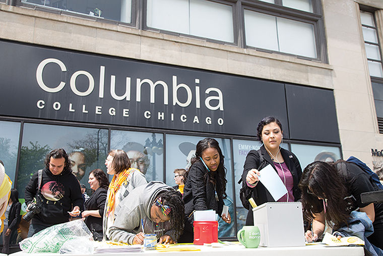 US of CC members gathered outside the 600 S. Michigan Ave. Building on May 6 to pass out informational flyers and ask students to write about the impact the college’s staff has had on their education. 