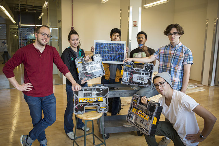 Students in a product design class display a collaborative project using solar energy that they have been working on with the Science & Mathematics Department. 