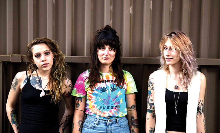 From left, Madalyn Garcia, Karissa Talanian and Hanna Hazard make up the punk band Lil Tits and plan to release a full-length album by the end of the year on vinyl with a tour following.
