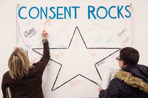 Susan Imus, chair of the Creative Arts Therapies Department, signed the “Consent Rocks” board to participate in the Stencil Project. 