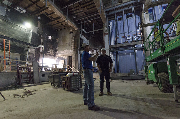 John Kavouris, Associate Vice President of Facilities and Operation at Columbia College, and Mike OMalley, Project Superintendent, stand within the stage area of the Getz Theatre, 72 E. 11 St. Kavouris said that renovations are expected to be done by the start of the Spring 2018 semester.