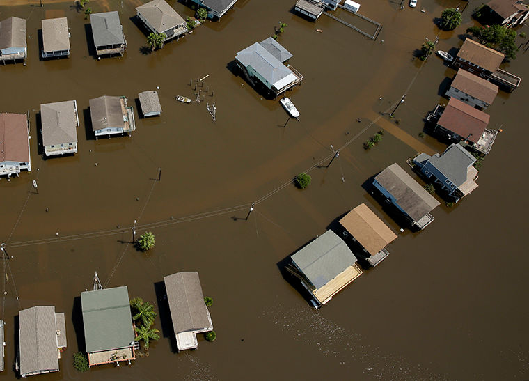 Homes are surrounded by flood water in the aftermath of Hurricane Harvey Sept. 1 near Houston, Texas.  