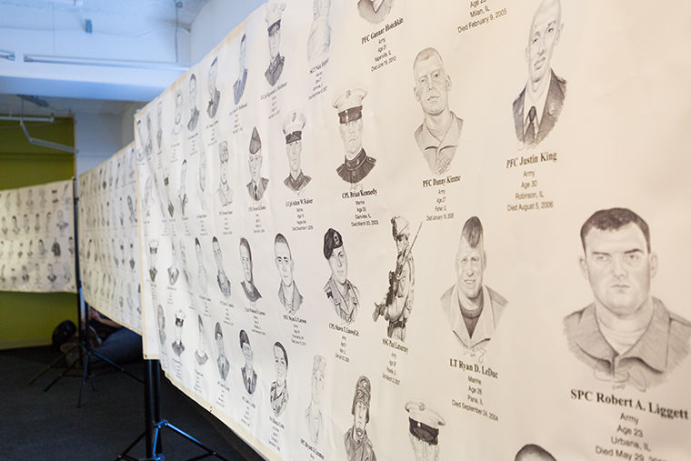 A display of Cameron Schillings Portrait of a Soldier, on the 3rd floor of our library, 624 S. Michigan Ave. The piece is consists of hand-drawn portraits of 291 fallen soldiers from Illinois.
