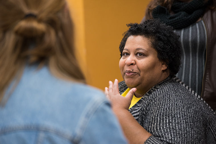 Comedian, Writer and Director Erica Watson working with senior design students at Columbia to do a complete re-design of her logo, merch and website. Photo taken during a class in 623 S. Wabash Ave. on Nov. 14.