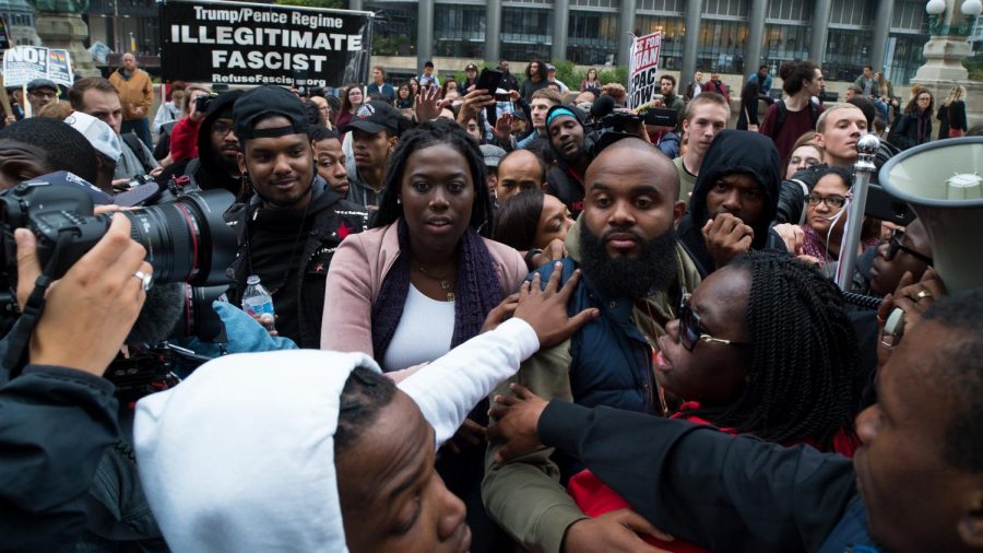 Activists embrace on Upper Wacker Dr.