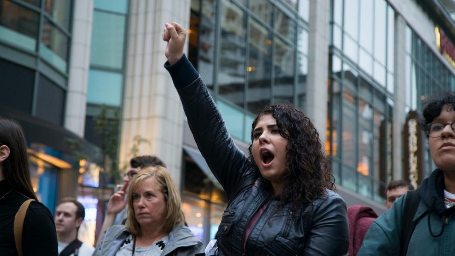 Odalis Farias raises her fist in celebration.