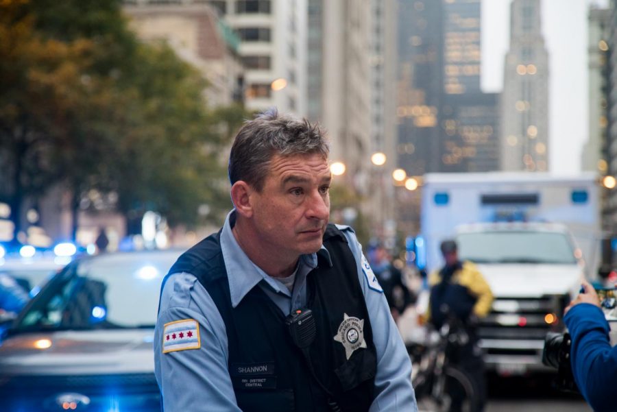 Chicago Police Officer Shannon watches demonstrators.