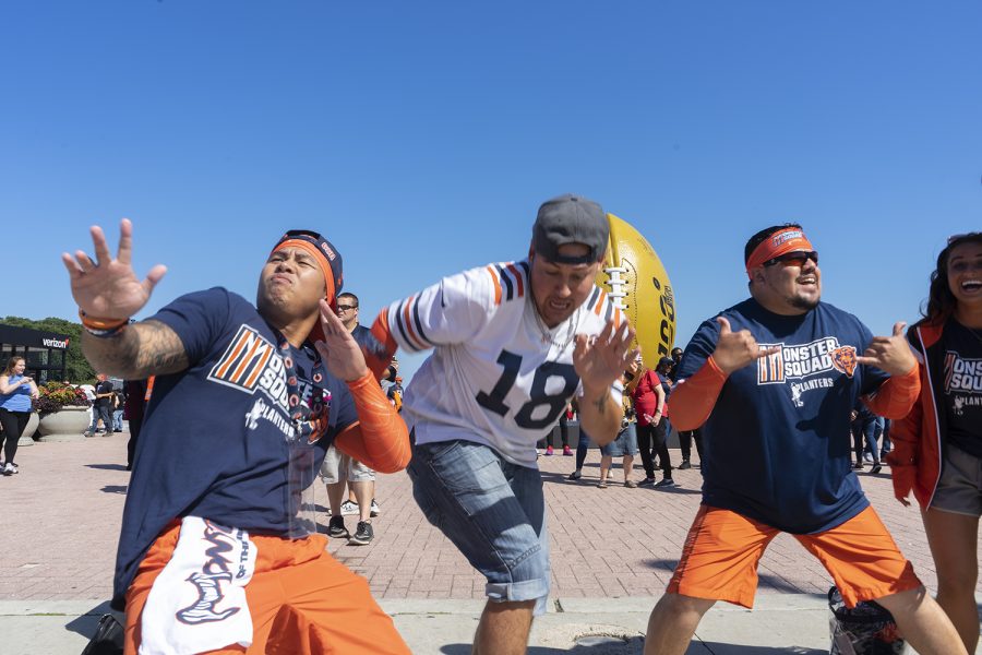 Members of the Monster Squad Chris Malabann, Gabriel Lozano and Levi Villanueva dance in front of Buckingham Fountain at the NFL Kickoff Experience Sept. 5. 