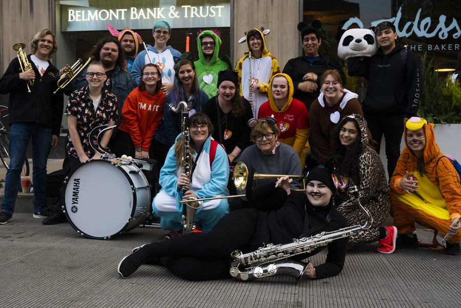 The Renegades Marching Band poses for a photo before performing at their first ever city parade during Arts in the Dark Oct. 19.
