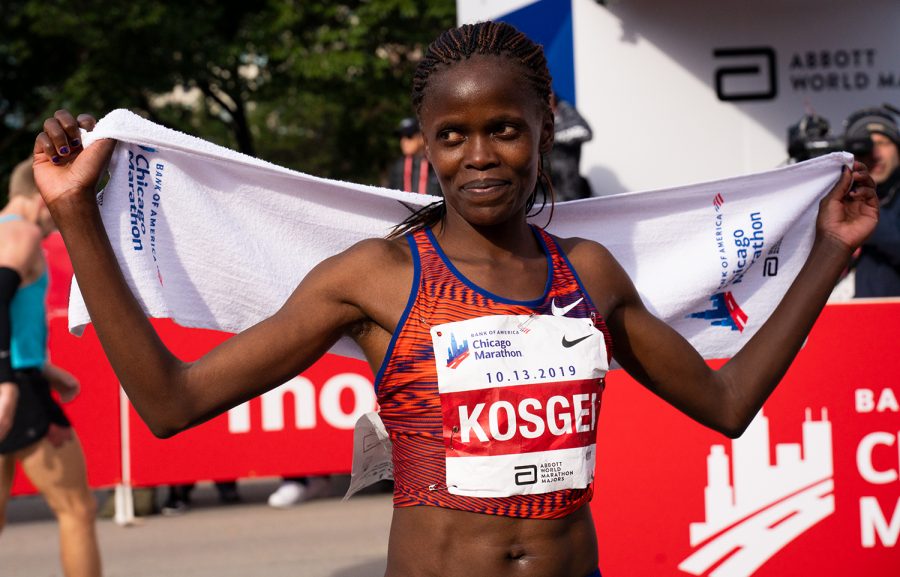 Brigid Kosgei, 25, poses after breaking the women's marathon world record at the 2019 Chicago Marathon Oct. 13.