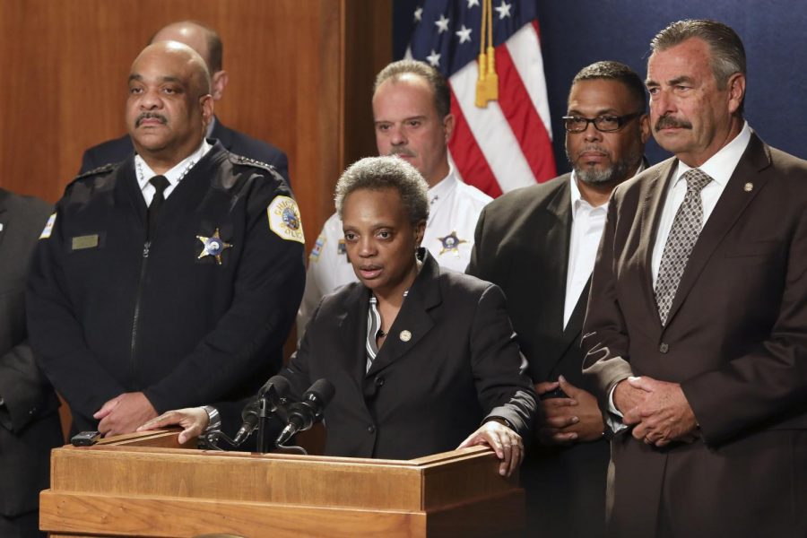 Mayor Lori Lightfoot (center) announced Friday that former chief of the Los Angeles Police Department Charlie Beck (right) would take over as police superintendent following the retirement of Eddie Johnson (left). 