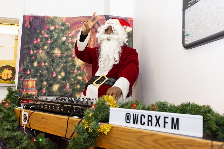Camron Miller dresses up as Santa Claus in preparation for the 17th annual Holly Jolly Food Drive at WCRX.