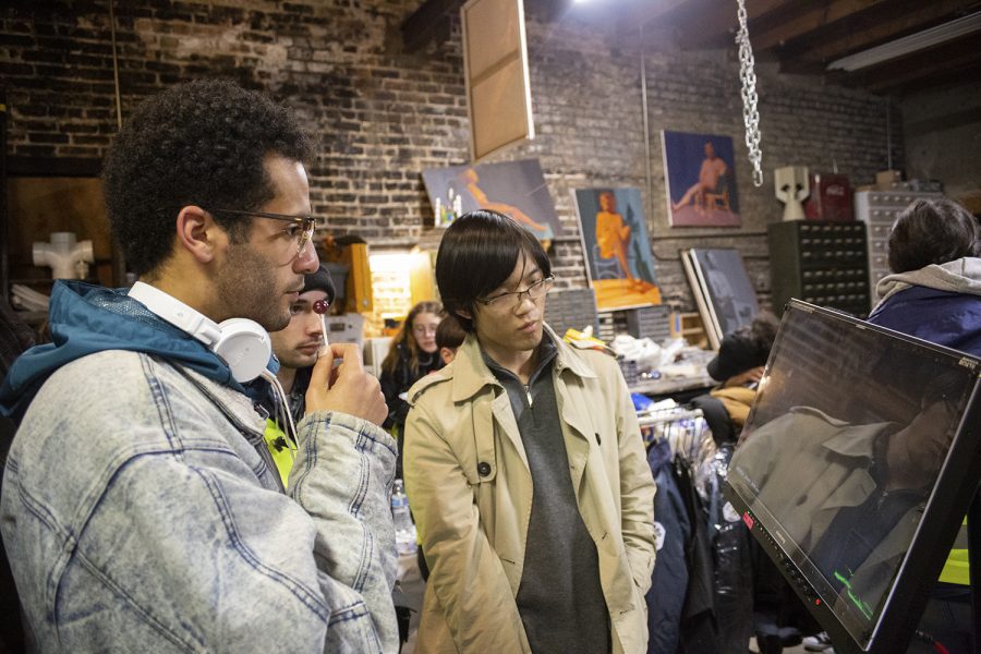 Orlando Pinder (left), director  for the 2019 practicum production of “Pegasus,” reviews footage on-set alongside student collaborators for the project. Practicum productions allow Cinema and Television Arts Department students to experience film sets similar to the industry before graduation, from production meetings to location scouting and set design. 