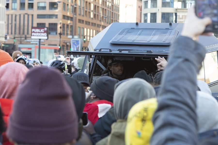 Quavo, one of the three Migos, helps give away free Adidas YZY QNTM shoes from the passenger seat of a Russian Sherp ATV.