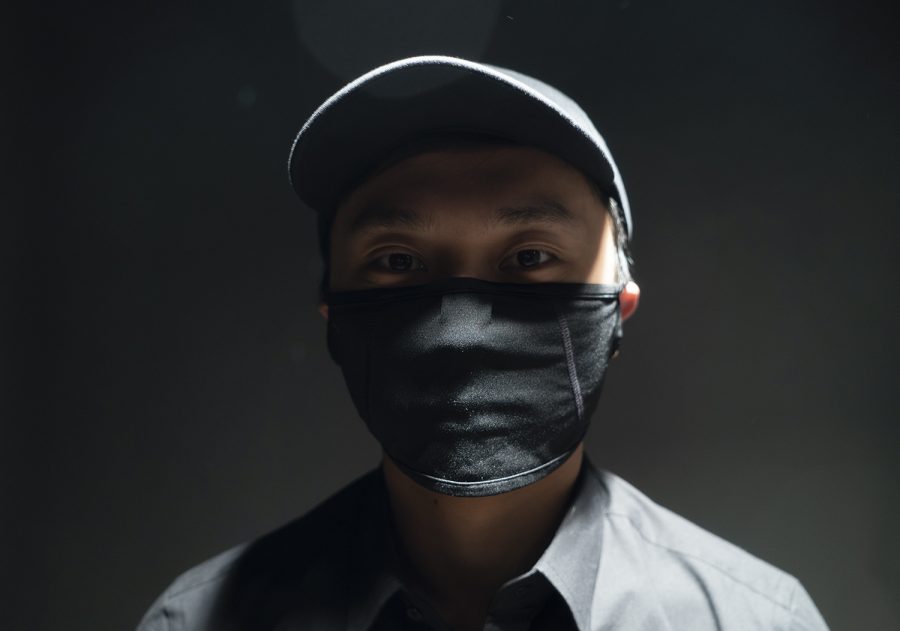 M.H. is organizing thousands of supplies, including medical masks similar to the one he is wearing, to be shipped to Hong Kong in the midst of surging prices due to the high demand. 
