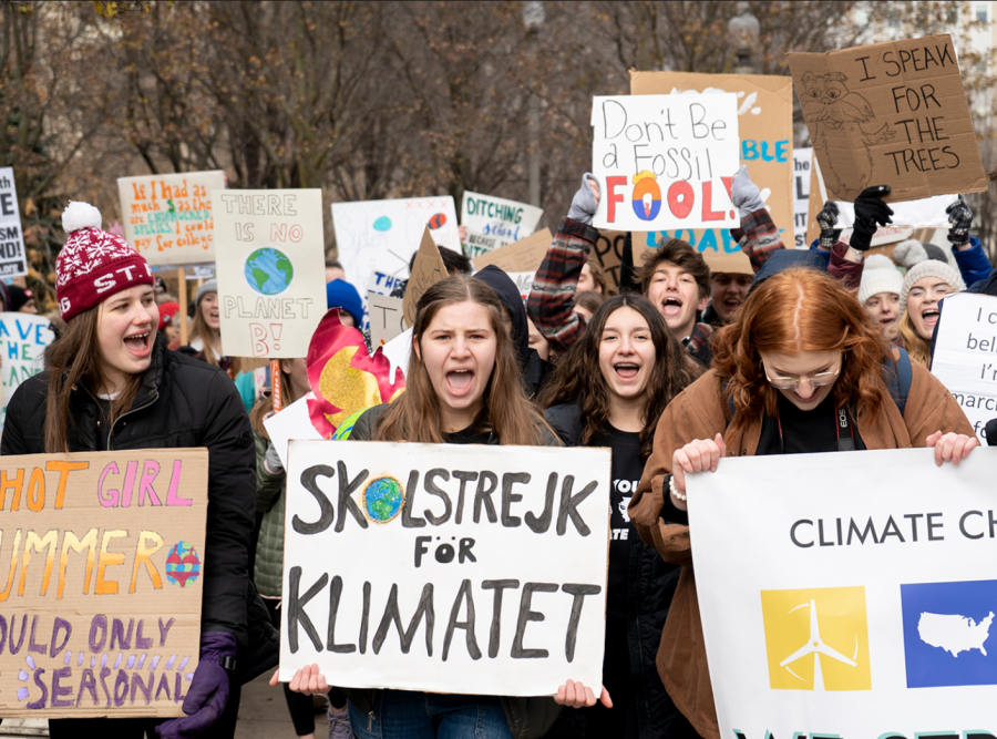 Activists march from Millennium Park to Federal Plaza during a Saturday, Dec. 7, 2019 climate strike led by Illinois Youth Climate Strike and the Sunrise Movement.