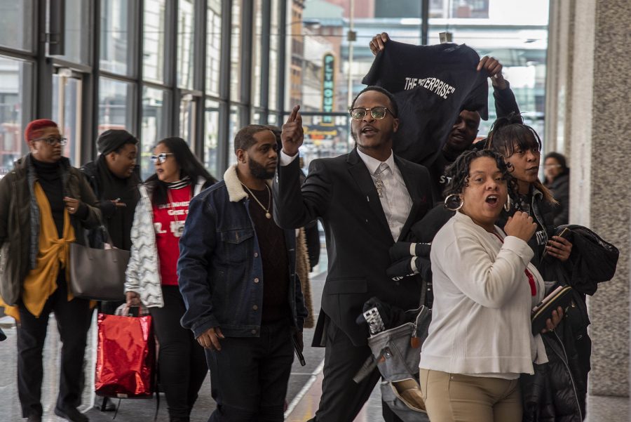 Defenders of R&B musician R. Kelly show their support for him after his hearing at the Dirksen Federal Building in downtown Chicago, Thursday, March 5.