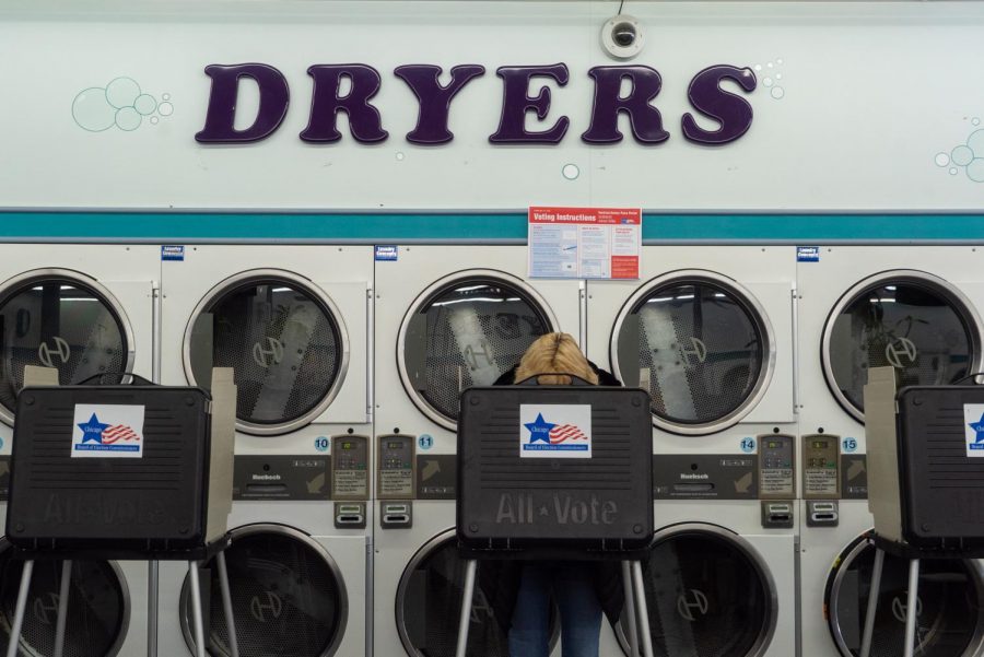 A voter at Su Nueva Chicago Laundromat in West Lawn casts a ballot in the Tuesday, March 17 Illinois primary.