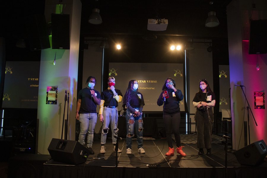 Founding members Tandrea Hawkins and Jordan Blair stand on stage with other Fusion of Light Entertainment organizers Dupree, Liam Taylor and Sofia Felino. 