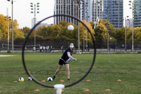 Quidditch players participate in socially-distanced activities like individual shooting drills and a 40-yard dash.