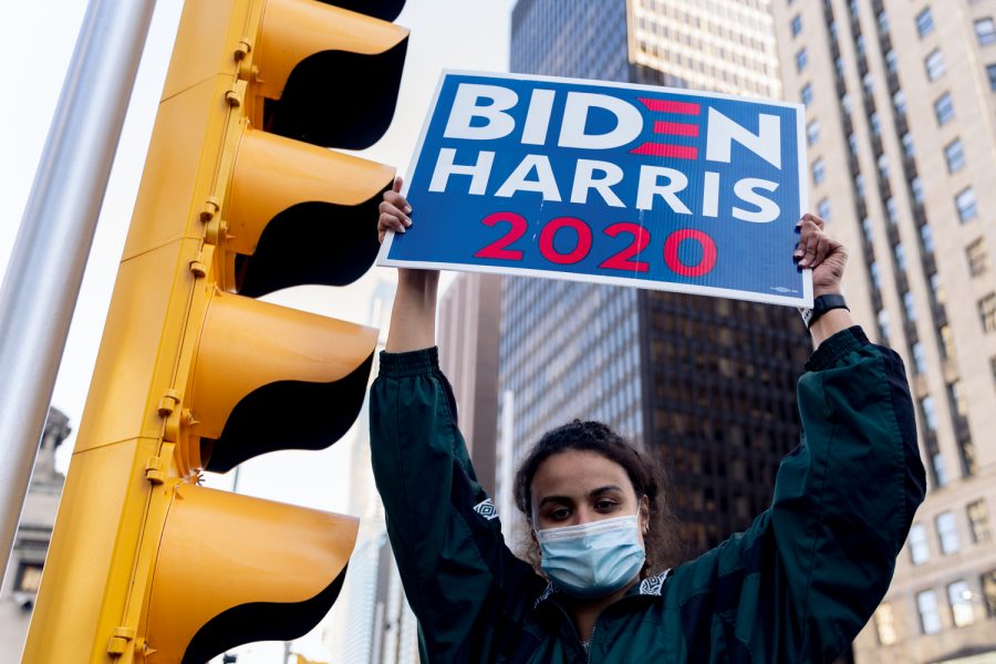 Hajar Khaled stands near the Michigan Avenue bridge showing her support for President-elect Joe Biden.