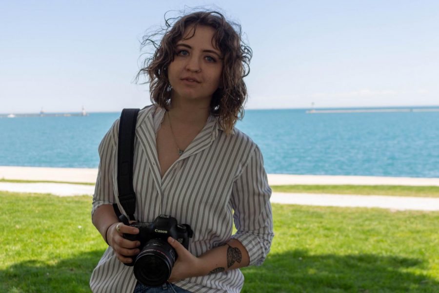 Kaylie Slack, Director of Photography, sits near Lake Michigan reflecting on her last staff meeting as a member of the Chronicle staff.