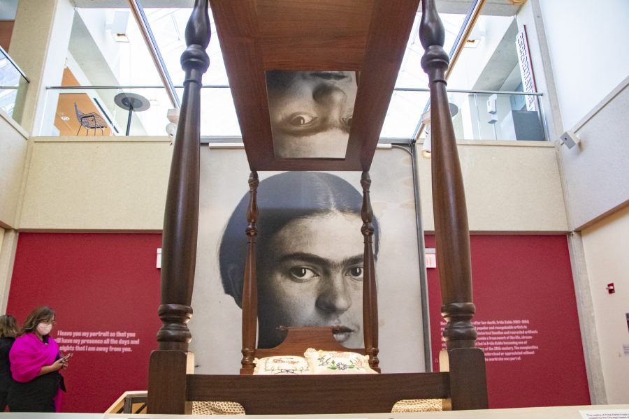 In front of a portrait of Frida Kahlo is displayed a replica of the bed from which she made a lot of her paintings after the bus accident. She used the mirror at the top of the bed to create self-portraits. 