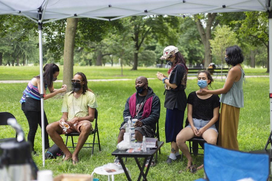 The healing station at Healing in the Park offered free reiki, acupuncture and herbs.