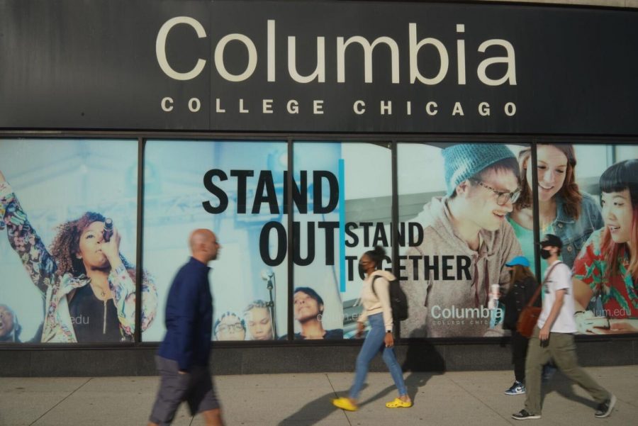 Students walk by Columbias 600 S. Michigan Ave., home of the campus Office of the Registrar, which initiated a new academic scheduling model.