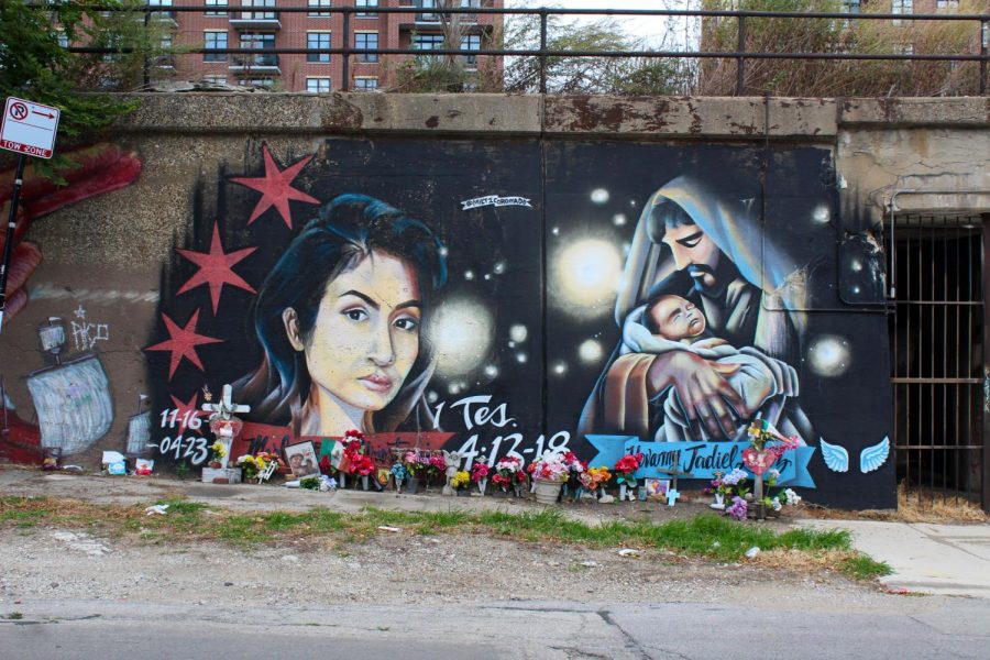 Marlen Ochoa-Lopez lived in Pilsen after immigrating to the U.S. She and her baby Yovanny Jadiel Lopez, who were both murdered, have a mural commemorating them, decorated with fresh flowers and a wooden cross for the two.