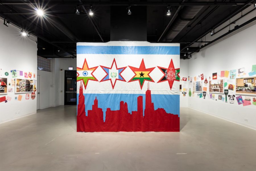 The exhibition includes a Chicago flag mural, which was created by children at a Heartland Alliance shelter.