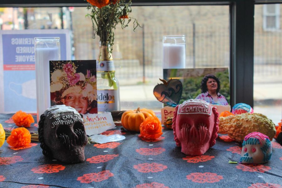 A small altar sits by the entrance of Cafe Jumping Bean, 1439 W. 18th St., which was packed the morning of Saturday, Oct. 30 with people buying sugar skulls, hot chocolate and coffee.