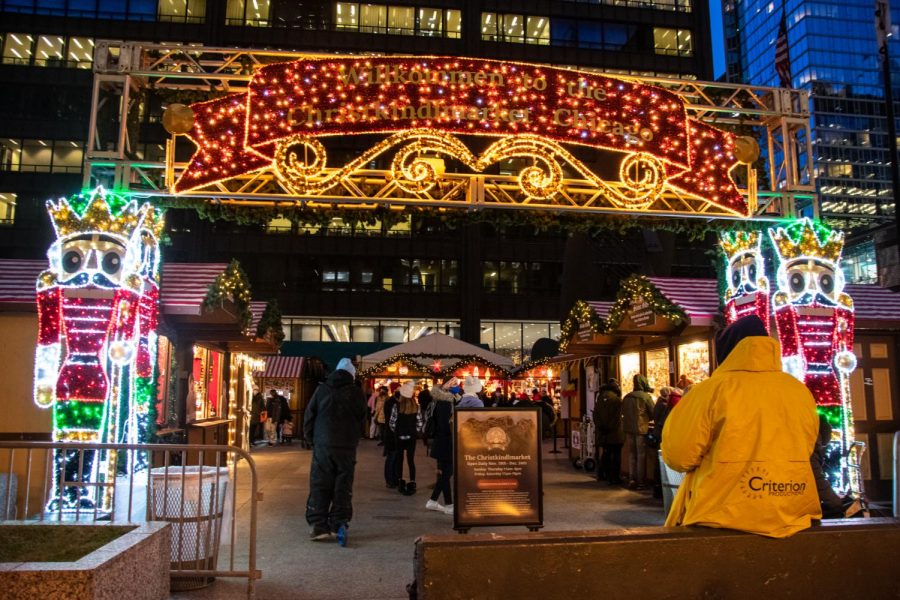 The brightly-lit German greeting, Willkommen to the Christkindlmarket Chicago, welcomes visitors to the holiday market. 