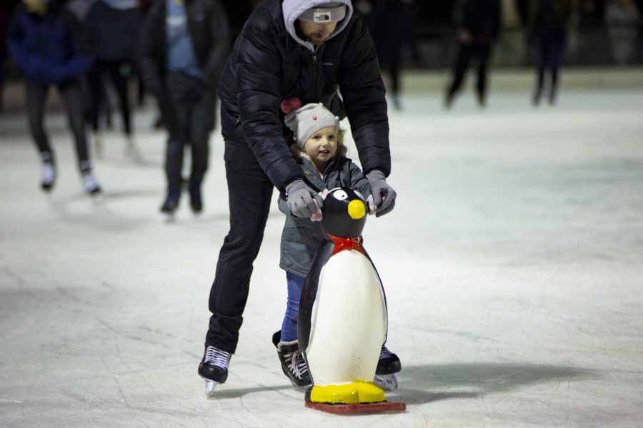 A parent helps their child ice skate at the McCormick Tribune Ice Rink in Millennium Park on Nov. 19.