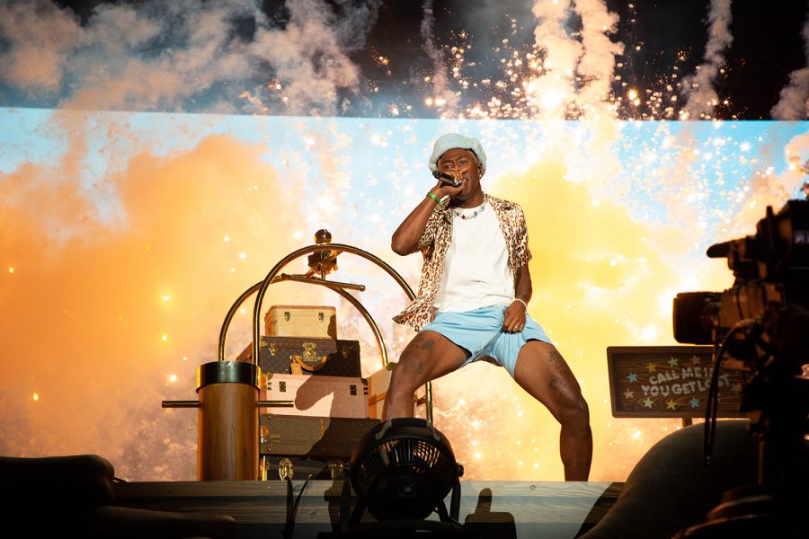 Tyler, the Creator jumps around as pyrotechnics light up the stage during the second day of Lollapalooza, July 30. 