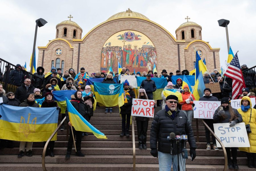 The rallygoers stand in front of Olha Ukrainian Catholic Church after the first Russian attack on Ukraine on Feb. 24.