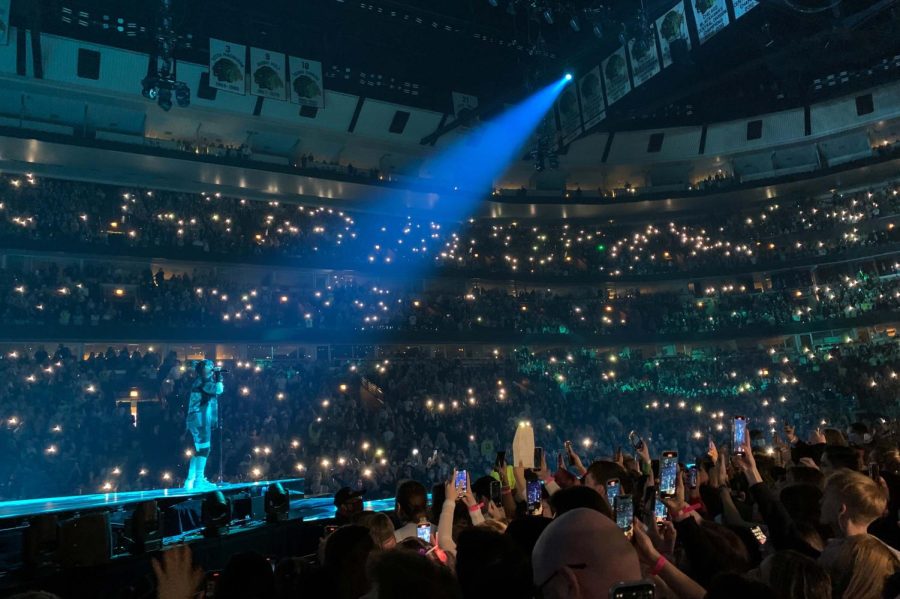 Fans hold their cellphone flashlights up during Billie Eilishs “Happier Than Ever” tour.
