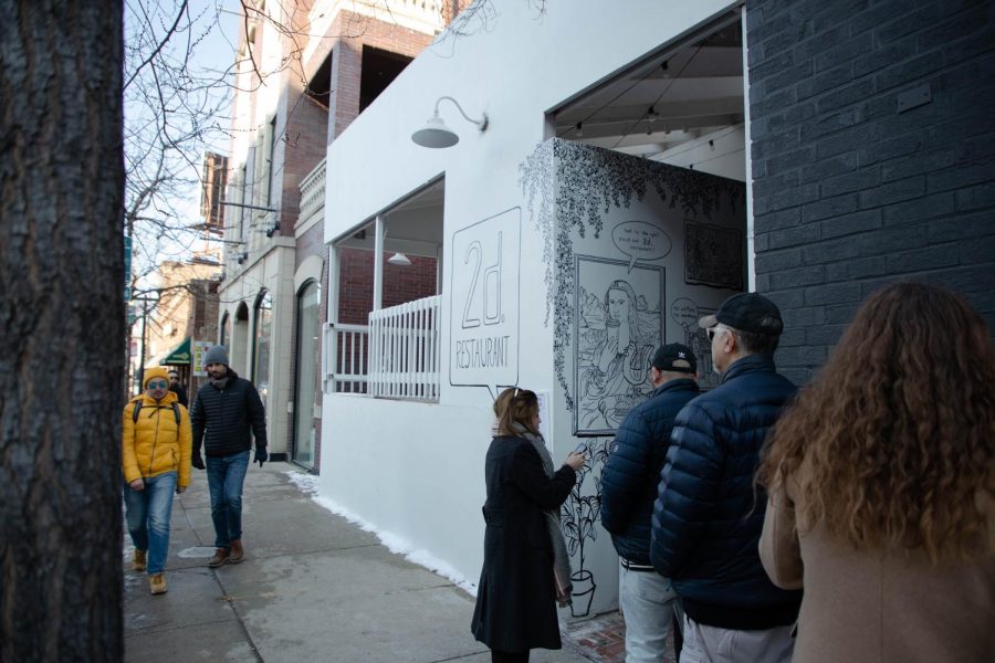 In a line spanning down the side of the 2D Restaurant, 3155 N. Halsted St., patrons wait to enter the new Lakeview eatery.