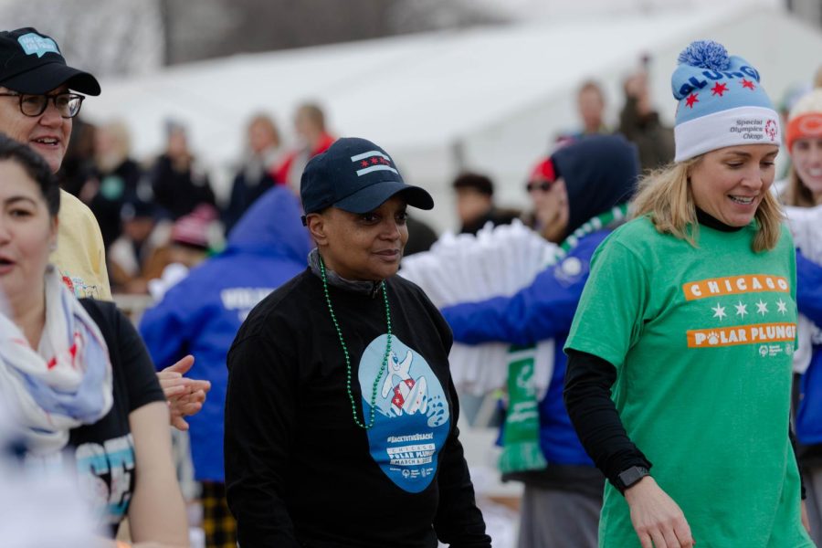 Chicago Mayor Lori Lightfoot leads the charge into Lake Michigan during the 22nd annual Chicago Polar Plunge.