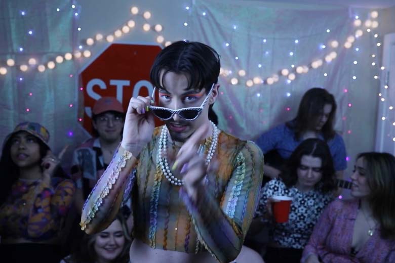 Liam Taylor parties in his soon-to-be-released Wasting Time music video while donning bright, colorful makeup and pearls. Courtesy of Liam Taylor.