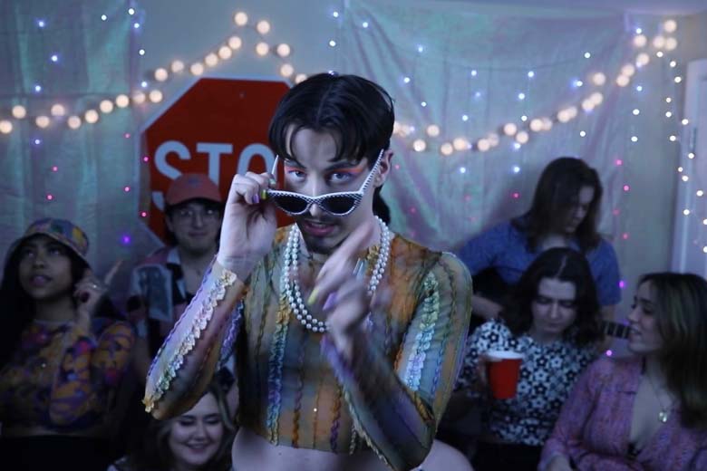 Liam Taylor parties in his soon-to-be-released "Wasting Time" music video while donning bright, colorful makeup and pearls. Courtesy of Liam Taylor.