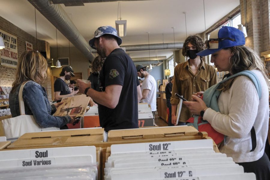 Vinyl enthusiasts fill Dusty Groove’s, 1120 N. Ashland Ave., on National Record Store Day, combing through the rows and rows of analog music.