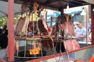 At Casa Mateos booth in Mole de Mayo, a Colombian restaurant located at 4001 S. Cicero Ave., meat is cooked in a traditional way using a Colombian llanera.